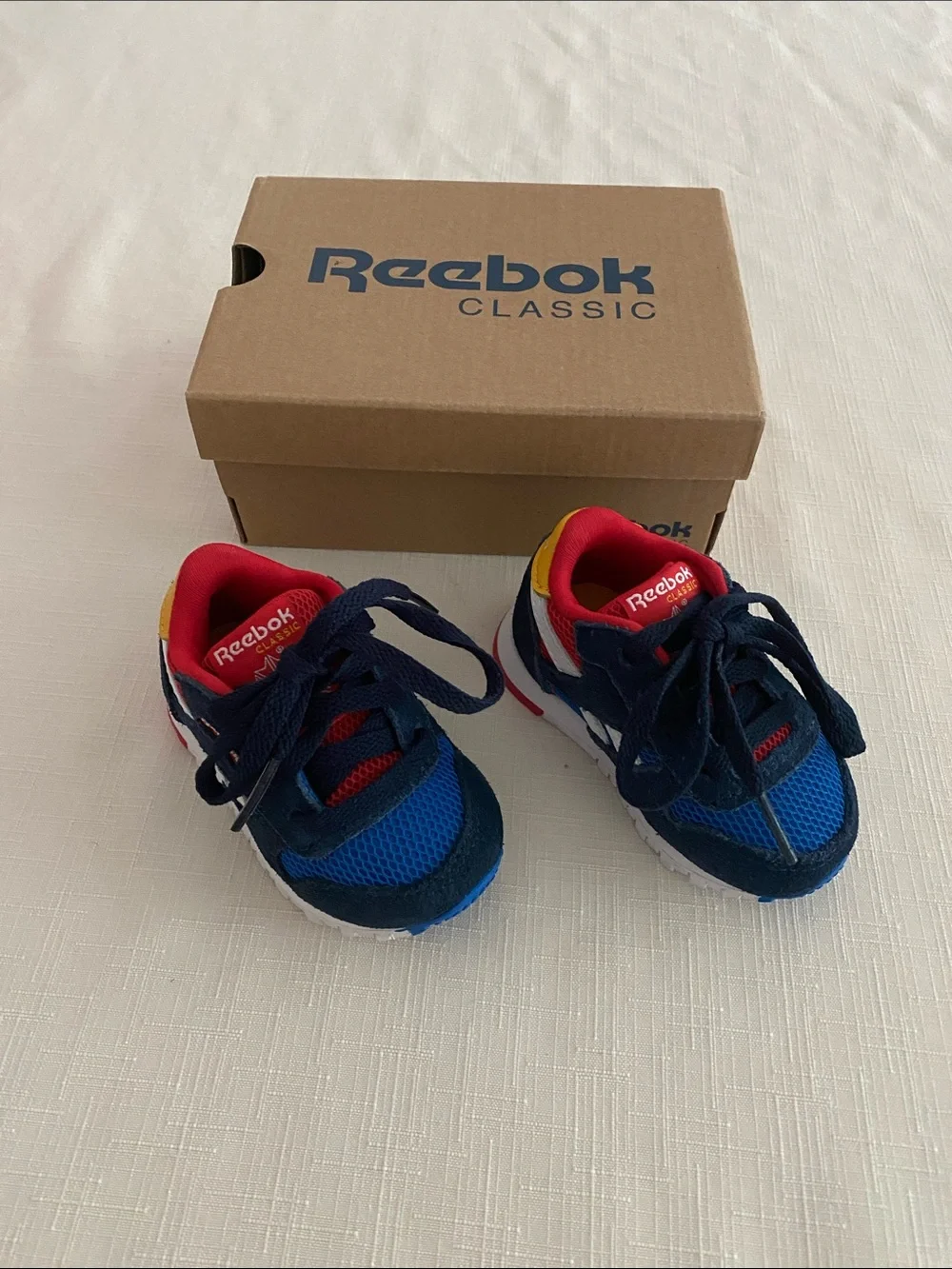 Reebok CL Leather Color Block Sneakers for babies.